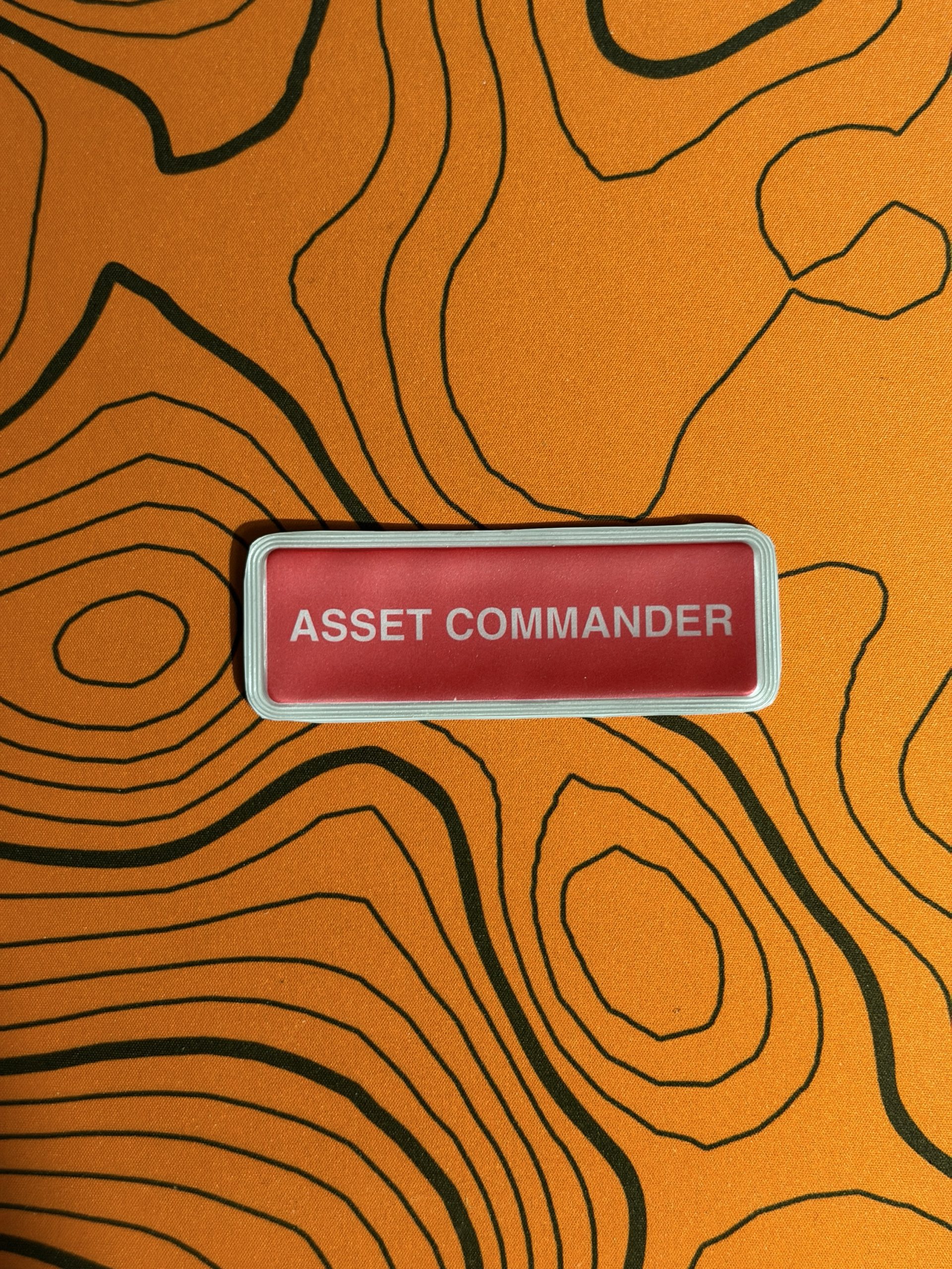 Asset Commander encapsulated badge